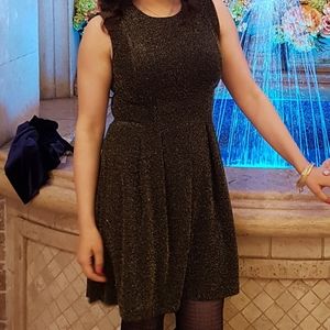 Black and gold fit and flare dress